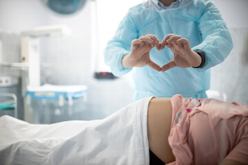 In the Hospital Woman Giving Birth Support by her Husband. Modern Delivery Ward. Painless...