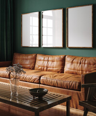 Three vertical wooden frame mockup in dark green home interior with brown leather sofa and decor, 3d render