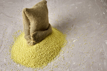 croup couscous poured out of a canvas bag on the table