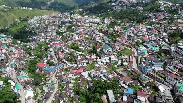 An incredible aerial flight and view of the houses and roads of the hill city of Kohima in Nagaland northeast India.