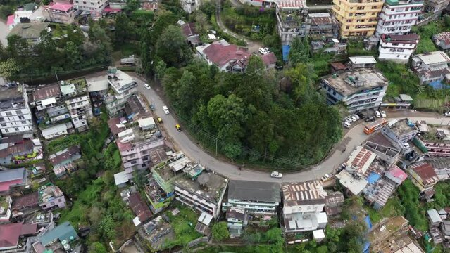 An aerial panning flight on a foggy day over the hill city of Kohima in Nagaland northeast India.