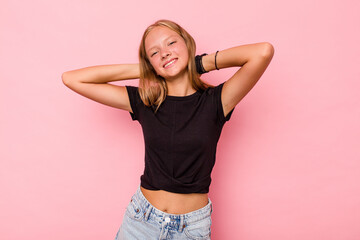 Caucasian teen girl isolated on pink background stretching arms, relaxed position.