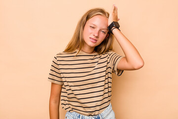 Caucasian teen girl isolated on beige background forgetting something, slapping forehead with palm and closing eyes.