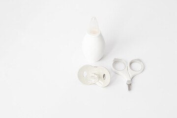 Child hygiene items. Gray and white baby care items on a white background