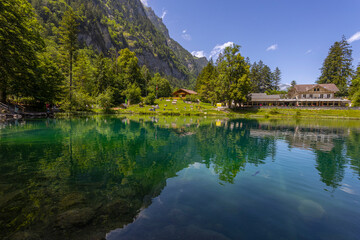 Fototapeta premium View of Blausee (The Blue lake) in Bernese Oberland, famous tourist destination in Switzerland