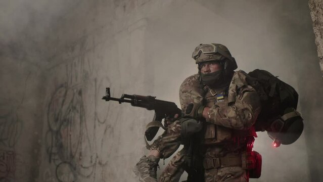 Evacuation of a wounded soldier. A soldier carries his wounded brother in arms from the battlefield.