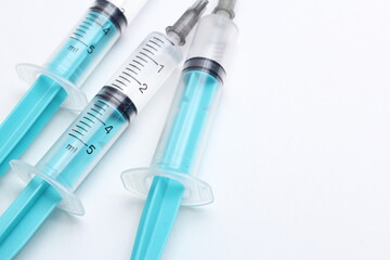 Medical syringe on a white background. A syringe for injection. The concept of health and beauty