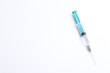 Medical syringe on a white background. A syringe for injection. The concept of health and beauty