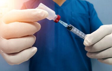 medical vaccination concept , doctor is prepareing vial of vaccine for injection