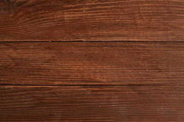 Vintage brown wood background texture with knots and nail holes. Old painted wood wall. Brown abstract background. Vintage wooden dark horizontal boards. Front view with copy space. Background for des