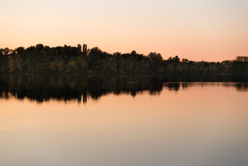 sunset over the river with reflection in the water	