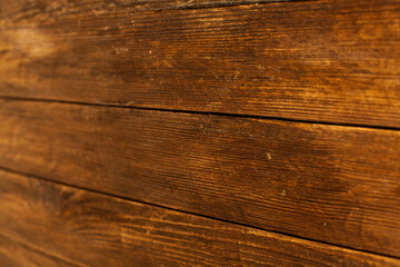 Vintage brown wood background texture with knots and nail holes. Old painted wood wall. Brown abstract background. Vintage wooden dark horizontal boards. Front view with copy space. Background for des