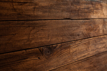 Vintage brown wood background texture with knots and nail holes. Old painted wood wall. Brown abstract background. Vintage wooden dark horizontal boards. Front view with copy space. Background for des