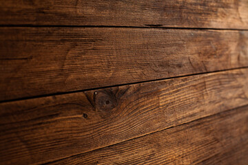 Vintage brown wood background texture with knots and nail holes. Old painted wood wall. Brown abstract background. Vintage wooden dark horizontal boards. Front view with copy space. Background for des