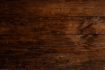 Vintage brown wood background texture with knots and nail holes. Old painted wood wall. Brown abstract background. Vintage wooden dark horizontal boards. Front view with copy space. Background for des