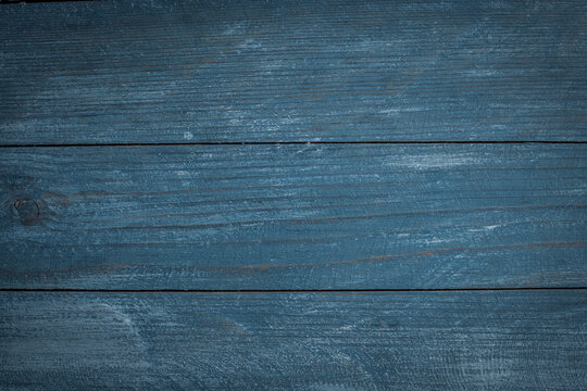 
Vintage blue wood background texture with knots and nail holes. Old painted wood wall. Blue abstract background. Vintage wooden dark blue horizontal boards. Front view with copy space. 