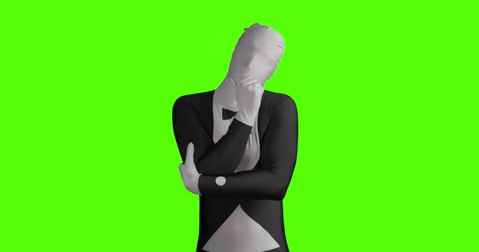 Static shot of a thoughtful business morphsuit. Businessman thinking about new ideas against green background