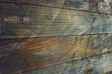 Vintage brown wood background texture with knots and nail holes. Old painted wood wall. Brown abstract background. Vintage wooden dark horizontal boards. Front view with copy space. 