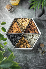 a set of nuts. a healthy snack. peanuts, pistachios, walnuts, macadamia, raisins