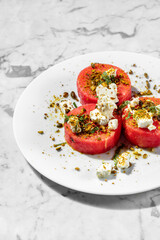 Watermelon with cheese and nuts