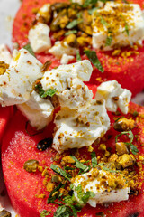 Watermelon with cheese and nuts