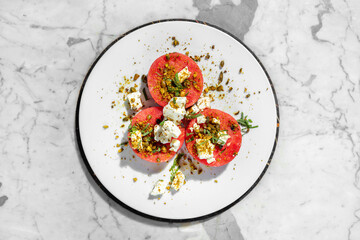 Watermelon with cheese and nuts