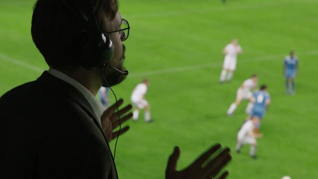 Side View Sports Commentator Analysing Soccer Match, Live Game. Silhouette of Announcer with Football Stadium and Field Before Him Commenting on the Seasons Best Moments, Talking about Top Players