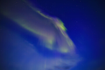 Naklejka na ściany i meble Aurora borealis in the sky astronomy night stars north shining