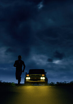 Man runs away from a vintage pickup truck with illuminated headlights on a country road under a dark sky. 3D render.