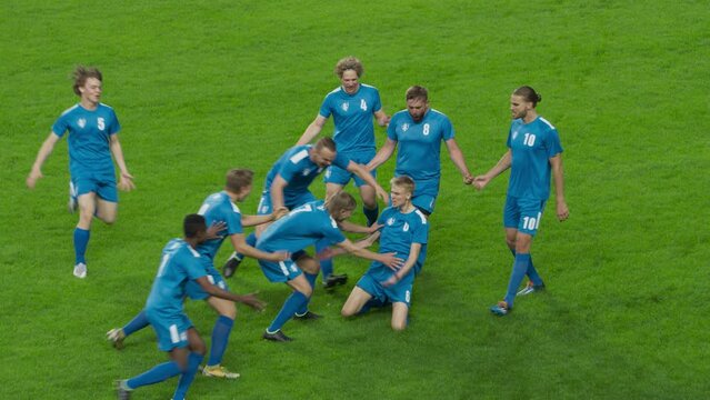 Championship Match: Blue Soccer Football Team Attack, Players Run Happy after Scoring Goal, Celebrate Victory, Hug, Slide on Knees. Sport Channel Broadcast Television Playback in Slow Motion
