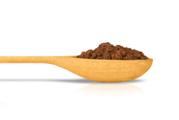 Heap of cocoa powder in a wooden spoon isolated on white background.
