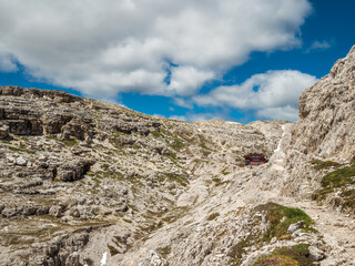 Panoramic hiking trail along the Tirol Sexten mountain chain during summer time
