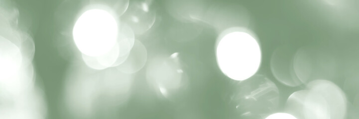 Blurred lights, green background, banner texture. Abstract bokeh with soft light header. Wide screen wallpaper. Panoramic web banner with copy space for design