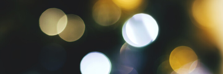 Blurred lights abstract background, banner texture. Christmas holiday defocused bokeh header. Wide...