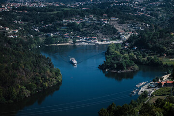 Fototapeta premium Douro River with a pleasure boat in the Douro Valley, Porto, Portugal.