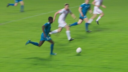 Soccer Football Championship: Blue Team Forward Attacks, Scores Goal, Win the Match, Players Happy, Celebrate Victory, Win Major League Cup. Sport Channel Broadcast Television Playback. Tracking Shot - Powered by Adobe