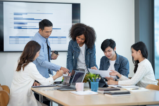 Beautiful Asian businesswoman presents her creative development planning strategy at a meeting on company sales strategy marketing.
