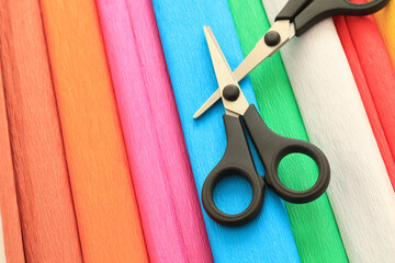 colorful crepe paper sheets and scissors