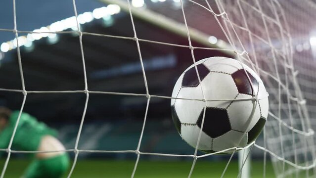 Football Championship: Ball Hits Net in Slow Motion. Goalkeeper Jumps and Fails to Protect Goals, Competition Scores Goal. Sport Channel Broadcast TV. Stylish Playback Repeat in Cinematic Slow Motion
