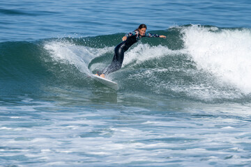 Surfer girl riding a wave