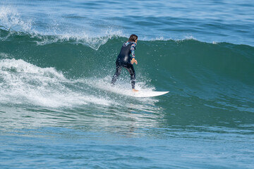 Surfer girl riding a wave