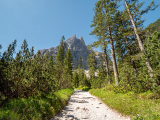 Panoramic hiking trail along the Tirol Sexten mountain chain during summer time