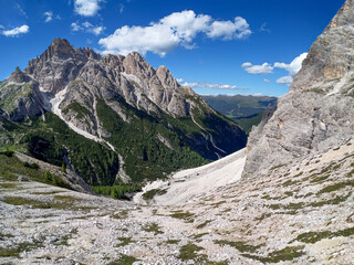 Fototapeta na wymiar Panoramic hiking trail along the Tirol Sexten mountain chain during summer time