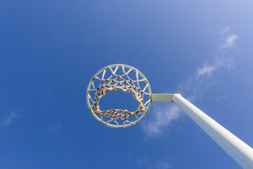 netball hoop net against blue sky © Veronica