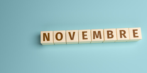 The Spanish word Novembre (November) built from letters on wooden cubes. High angle view with copy...
