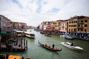 Fototapeta premium People enjoying gondola ride in Venice, Italy