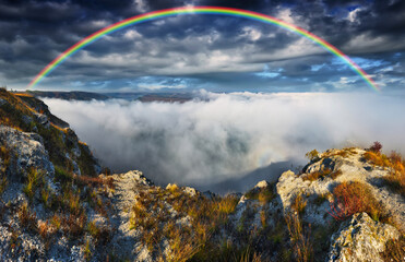 colorful rainbow over river canyon. nature of Ukraine