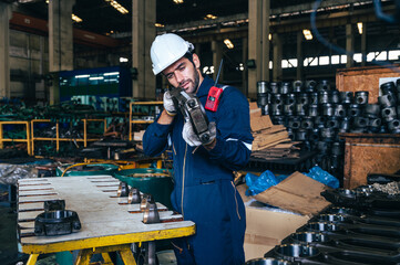 the technician repairing and inspecting the big diesel engine in the train garage 