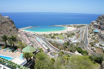 Aerial view of a beachside resort area under the blue sky on a sunny summer day