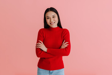 Obraz premium Asian young woman wearing sweater smiling and looking at camera
